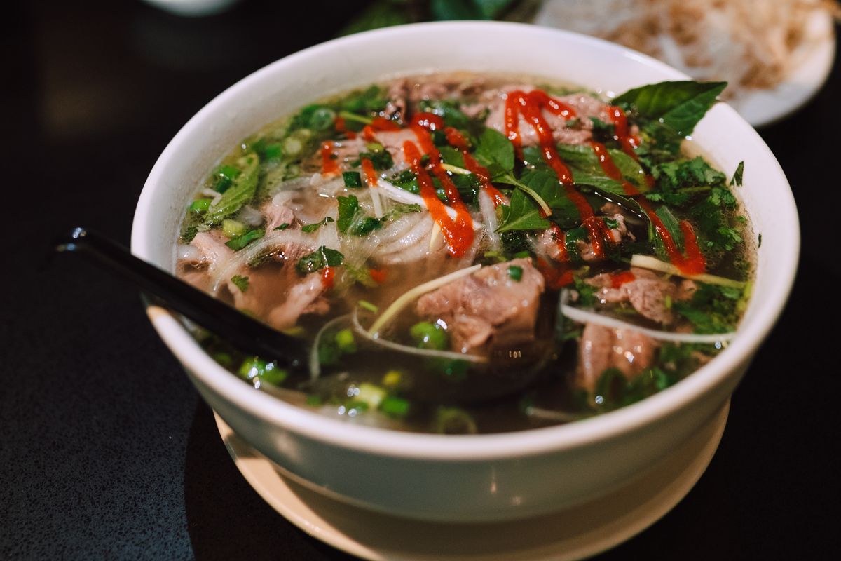 Pho close-up with herbs